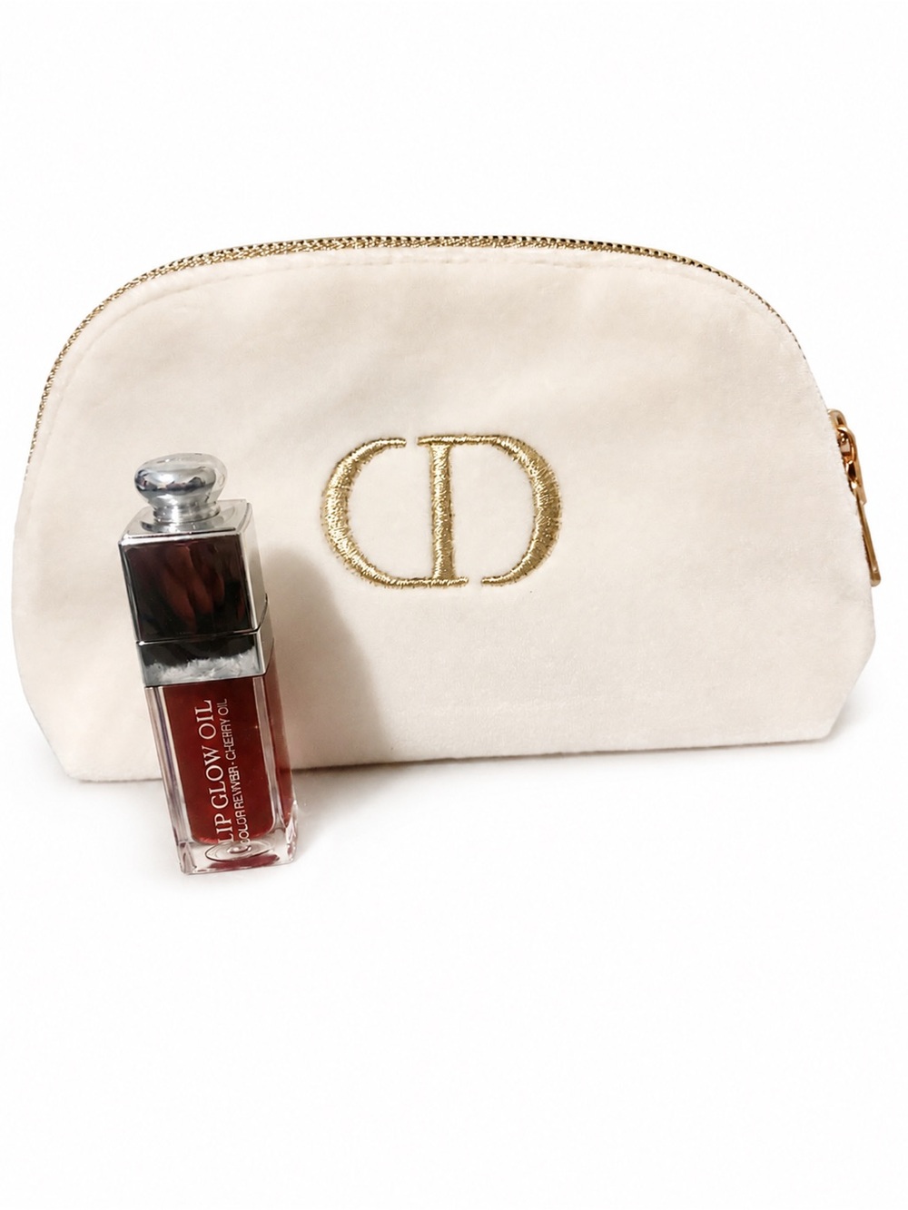 Dior Beauty Cream Velvet Makeup Pouch with Dior lip oil .